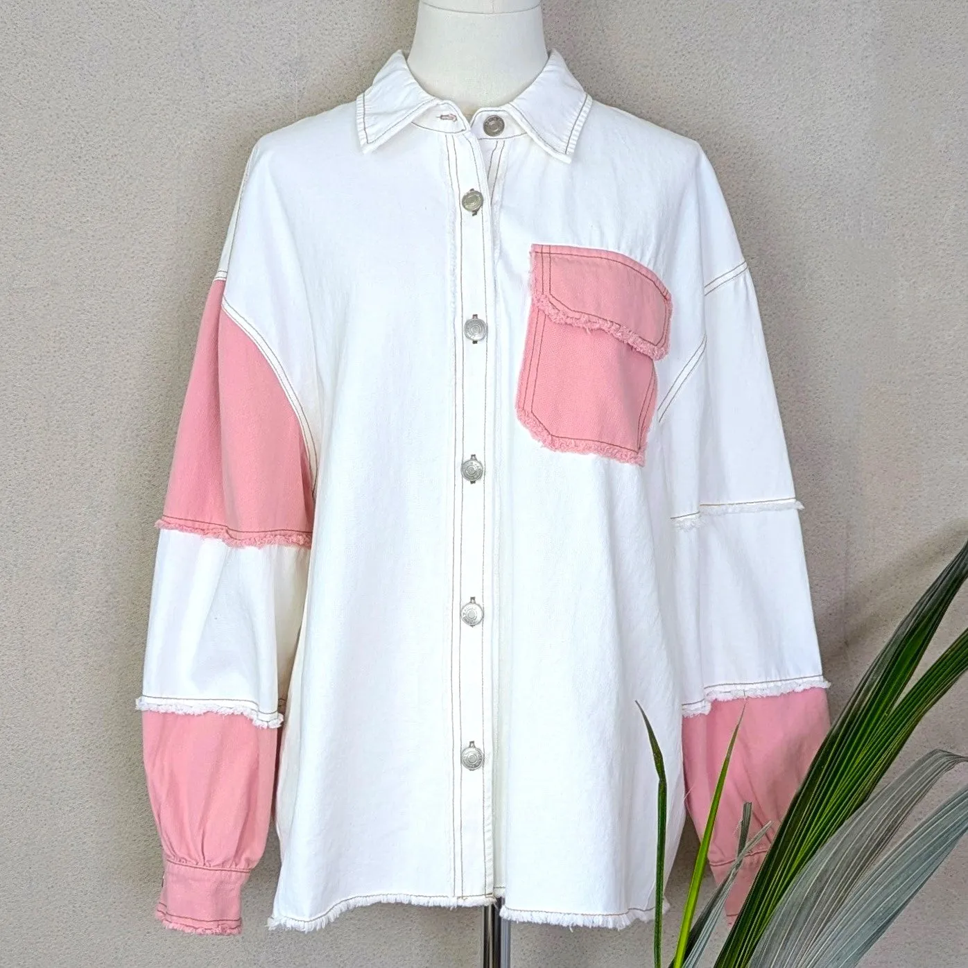 Off white denim jacket with colour patch pocket and arm sections and distinctive stitching